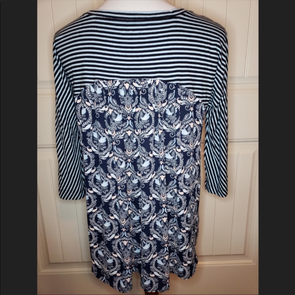 Loft top with pattern on the back.